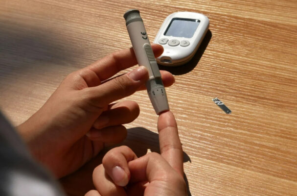 Organized diabetic supplies bundled for resale including test strips, CGM sensors, and insulin pump supplies