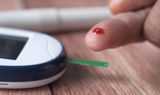 Factory-sealed diabetic test strip boxes being evaluated for resale value and payout